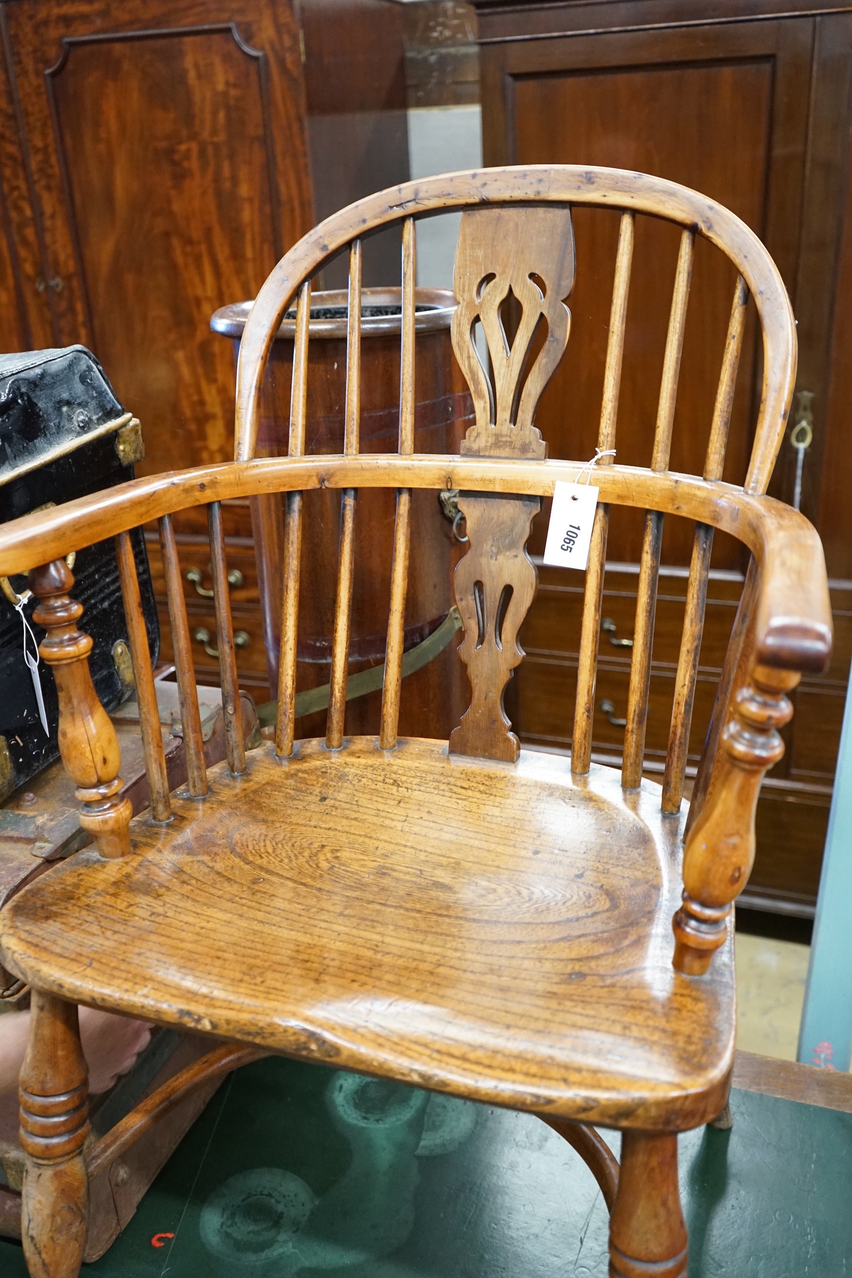A Victorian yew and elm Windsor elbow chair, with crinoline stretcher, width 53cm, depth 44cm, height 90cm